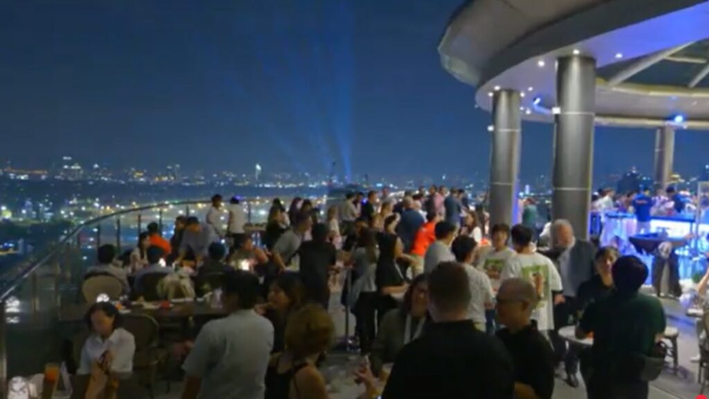Crowd on a roof networking.